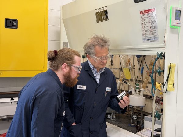 Dr. Krys and an R&I chemist inspect a label. 